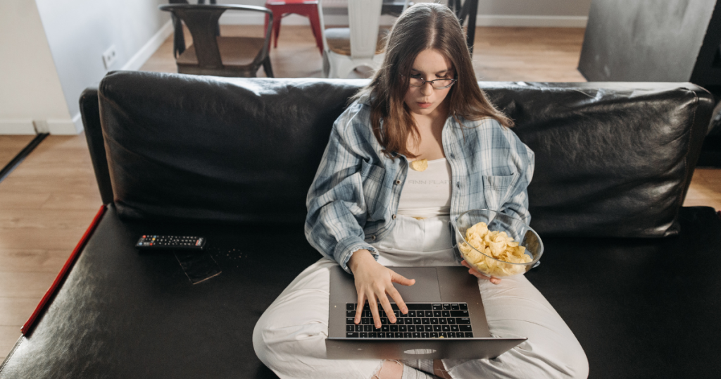 Women on comfortable black leather sofas